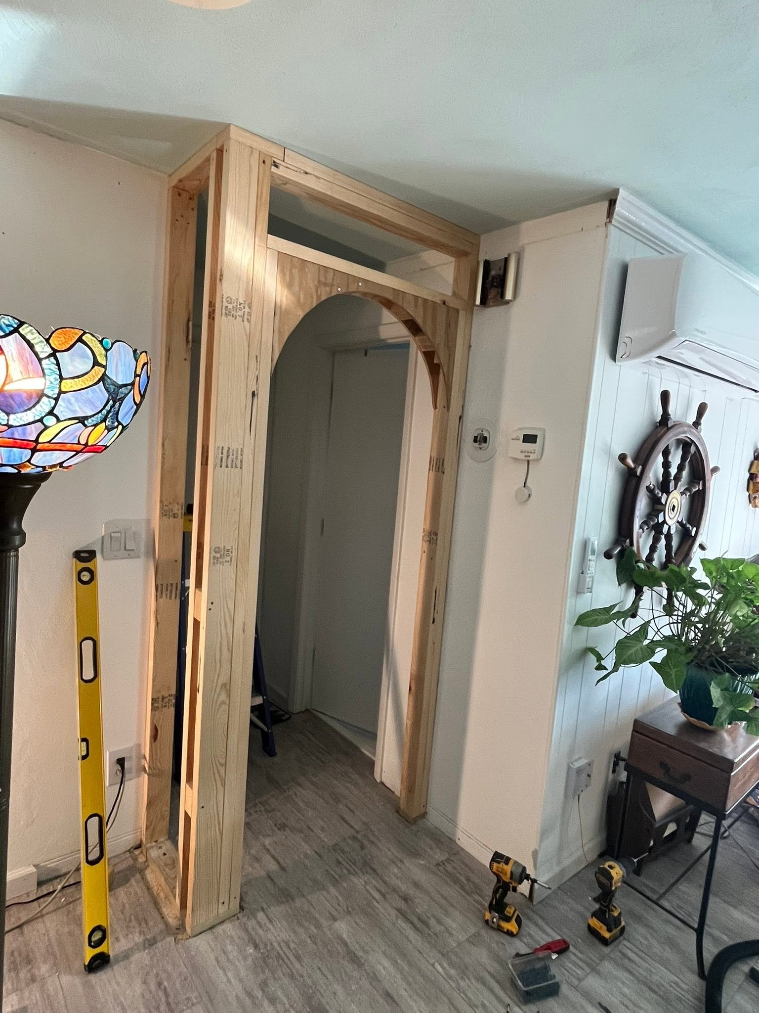 Framed archway under construction before finishing